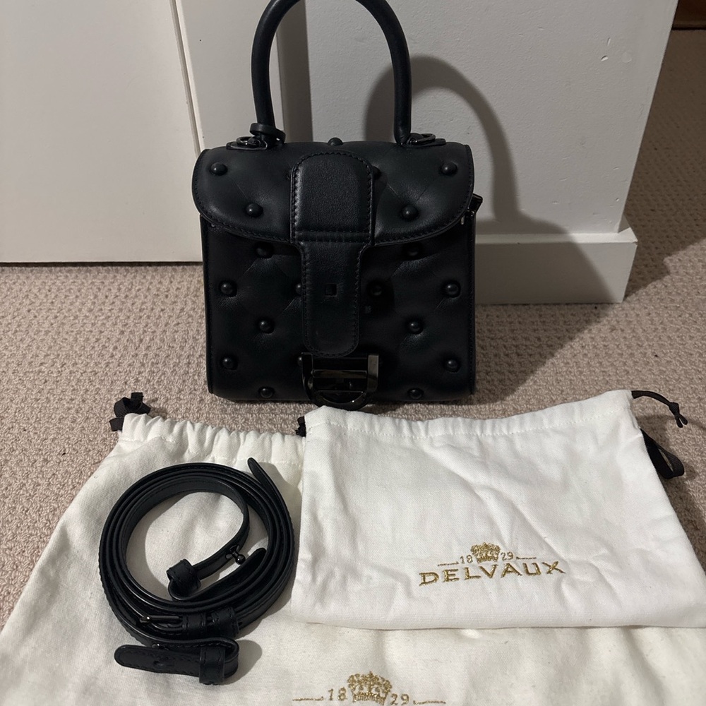 Black Mini Bag with Textured Design and Detachable Strap